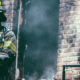fireman controlling fire damage