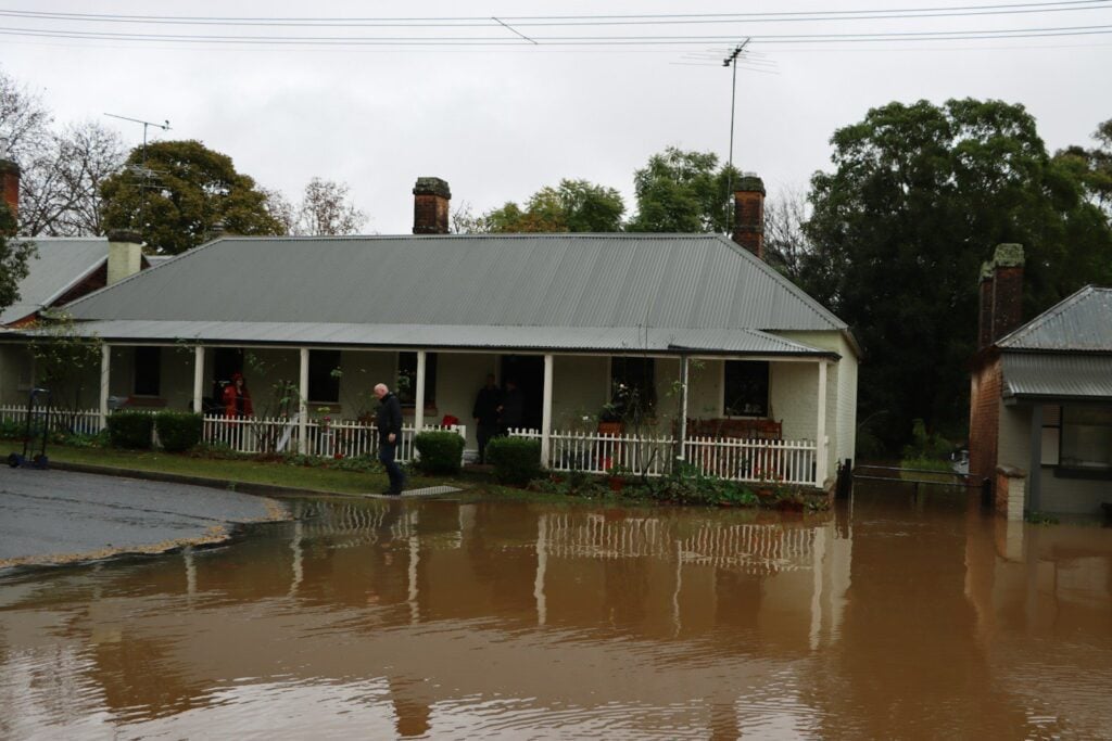 A flooded house with water damages that may not be covered by insurance policy.