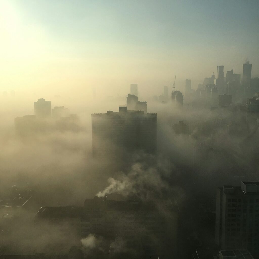 City with high-rise building covered with fogs. Indoor air quality matter most because we live there!